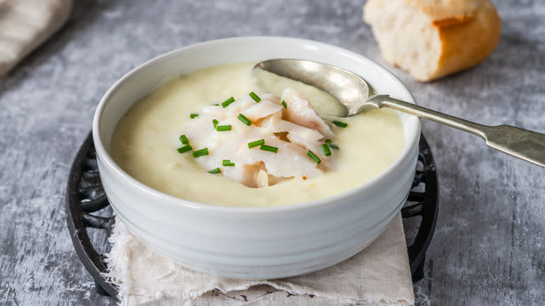 White soup topped with fish