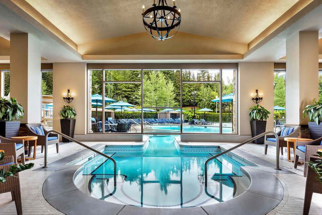 <p>Courtesy of Fairmont Chateau Whistler</p> An indoor-outdoor pool at the Fairmont Chateau Whistler in British Columbia.