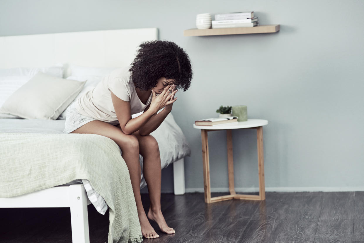 Woman suffering with a hangover. (Getty Images)