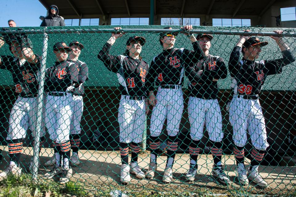 Harbor Creek baseball players watch the game from the dugout on April 29 at the Harbor Creek-Erie High game at Ainsworth Field in Erie.