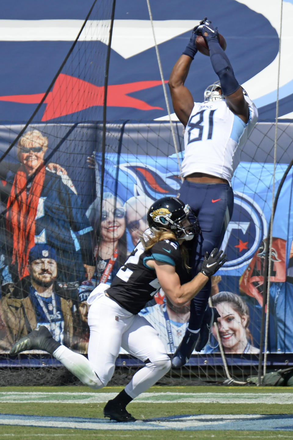 Tennessee Titans tight end Jonnu Smith (81) catches a touchdown pass over Jacksonville Jaguars safety Andrew Wingard (42) in the first half of an NFL football game Sunday, Sept. 20, 2020, in Nashville, Tenn. (AP Photo/Mark Zaleski)