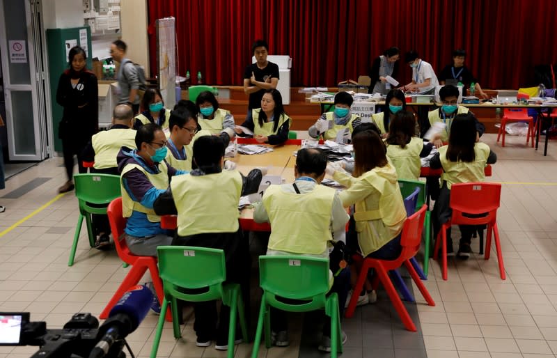 Polling officials count votes of the Hong Kong council elections, in a polling station in Hong Kong