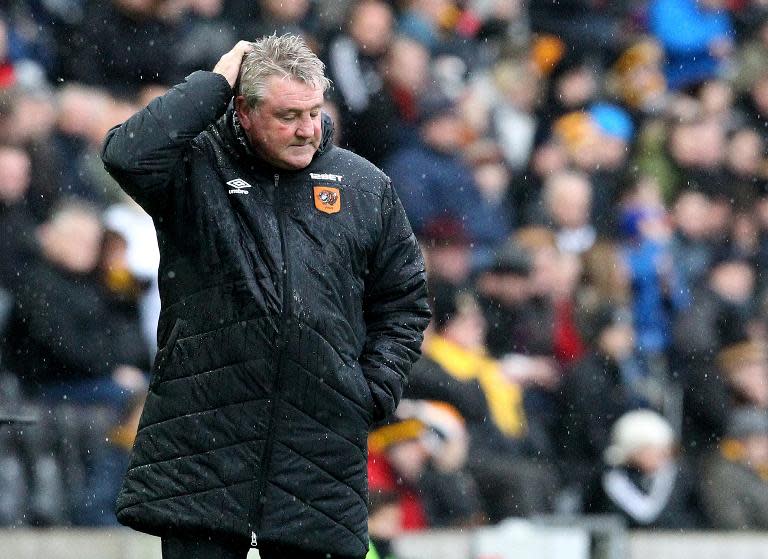 Hull City's manager Steve Bruce watches their English Premier League match against Newcastle United, at the KC Stadium in Hull, northern England, in January 2015