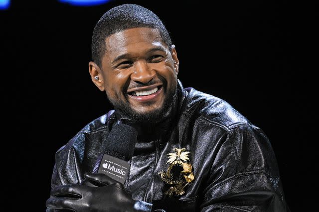 <p>PA Wire/PA Images via Getty</p> Usher on stage during the Apple Music Super Bowl LVIII Halftime Show Press Conference held in Las Vegas on Feb. 8, 2024