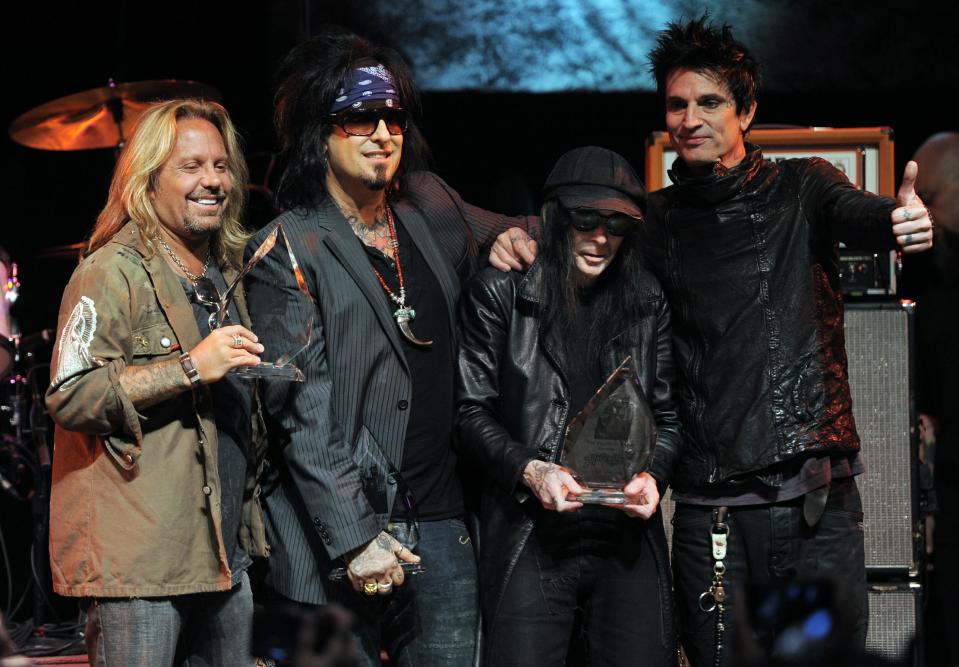 FILE - In this Aug. 18, 2011 file photo, from left, Vince Neil, Nikki Sixx, Mick Mars and Tommy Lee of the band Motley Crue pose together onstage at a tribute to the band to launch the 4th Annual Sunset Strip Music Festival in West Hollywood, Calif. The heavy-metal band says it will retire after performing 72 goodbye concerts. The band made the announcement at a press conference Tuesday, Jan. 28, 2014, in Hollywood. (AP Photo/Chris Pizzello, File)