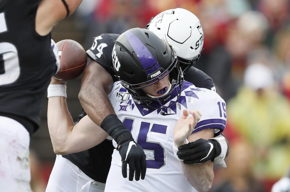 TCU quarterback Max Duggan fumbles as he is hit by Iowa State linebacker O'Rien Vance (34) during the first half of an NCAA college football game, Saturday, Oct. 5, 2019, in Ames, Iowa. (AP Photo/Charlie Neibergall)