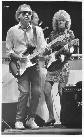 <p>Courtesy Marshall Chapman</p> Buffett and Chapman perform in concert together. Chapman joined Buffett's Coral Reefer Band in 1987 to play rhythm guitar and sing background vocals.