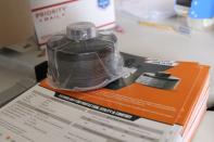 An NBC-77 SOF CBRN gas mask filter sits on the table in the Mira Safety warehouse in Austin