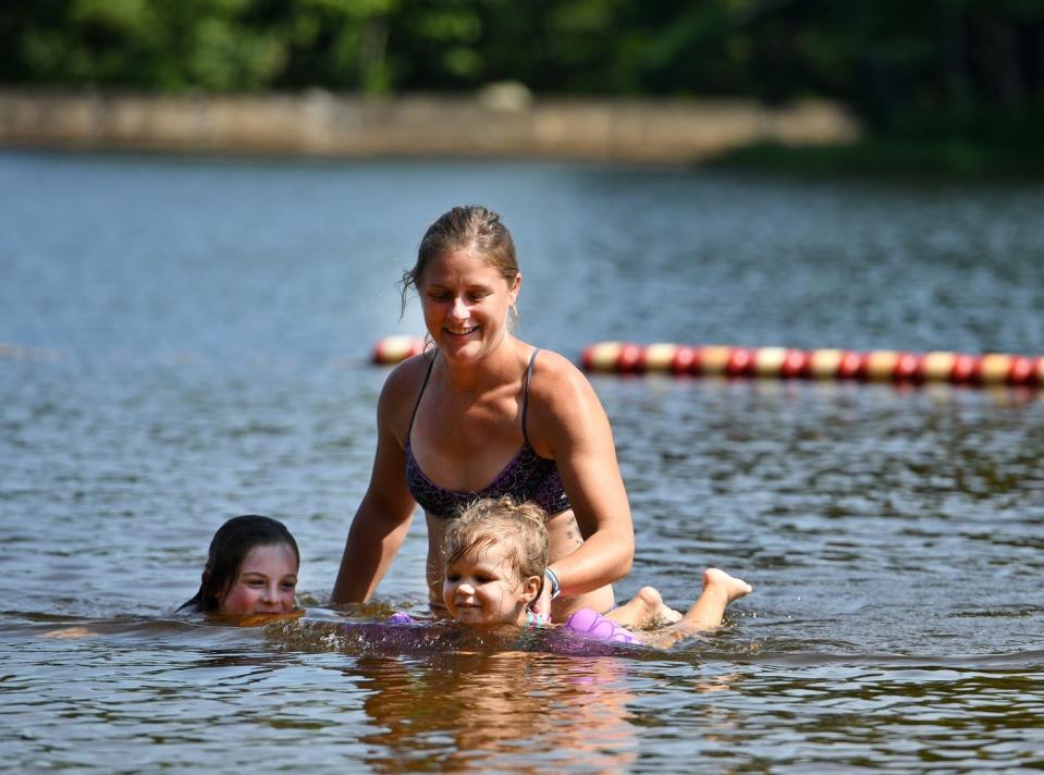 A young family enjoy swimming at Rutland State Park in Rutland.