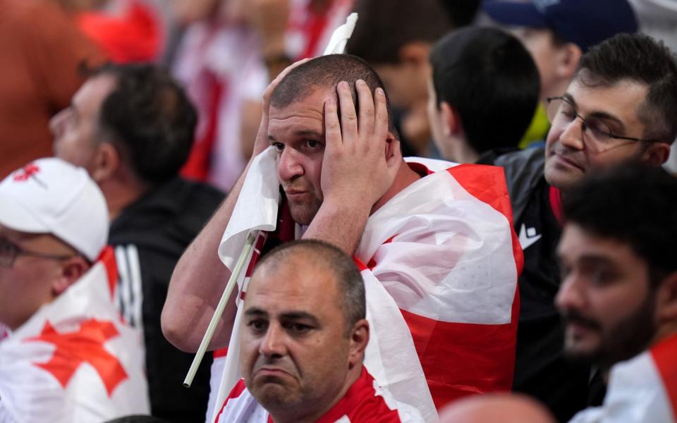 Georgia fan with his head in his hands