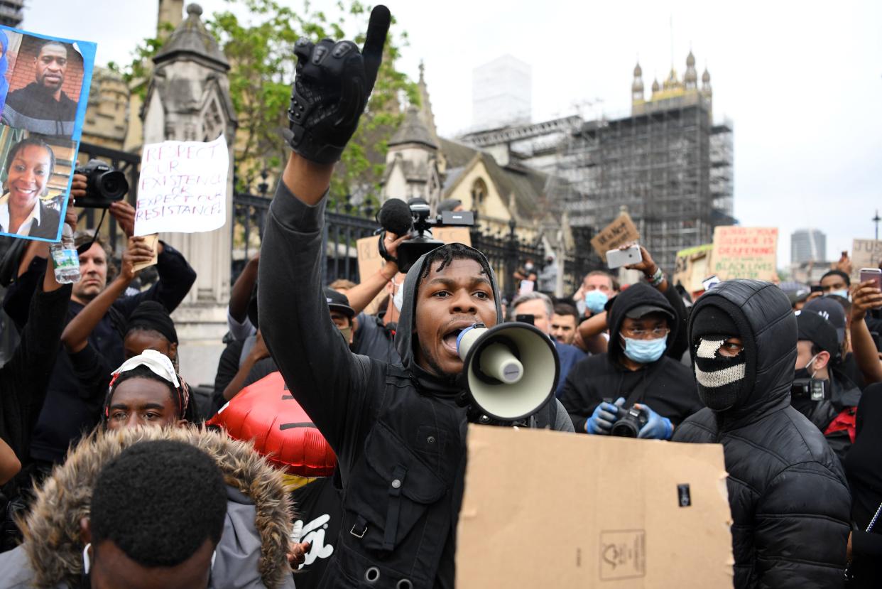 John Boyega speaks to protestors in Parliament square during an anti-racism demonstration in London, on June 3, 2020. (Photo by Daniel Leal-Olivas/AFP via Getty Images)