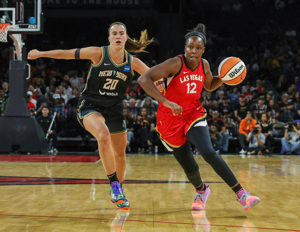 Las Vegas Aces guard Chelsea Gray is defended by New York Liberty guard Sabrina Ionescu during a preseason game on May 13, 2023 in Las Vegas. The teams meet in the regular season for the first time on Thursday. (Ethan Miller/Getty Images)