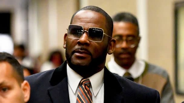 FILE - Musician R. Kelly, center, leaves the Daley Center after a hearing in his child support case on May 8, 2019, in Chicago. Closing arguments are scheduled Monday, Sept. 12, 2022 for R. Kelly and two co-defendants in the R&B singer’s trial on fed (The Associated Press)