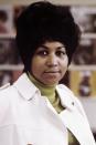 <p>The higher the hair, the closer to God. Aretha Franklin’s big hairstyle balanced out her olive green turtleneck and trench coat. (Photo by RB/Redferns) </p>