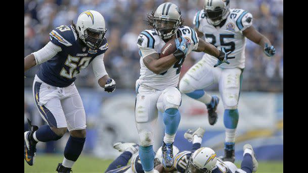 Carolina Panthers running back DeAngelo Williams breaks tackles on his way to a 45 yard touchdown reception against the San Diego Chargers during the first half of an NFL football game Sunday, Dec. 16, 2012, in San Diego. (AP Photo/Gregory Bull)