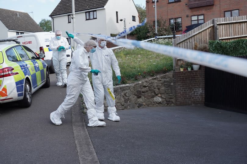 Police in Pump Hill after the bodies were discovered