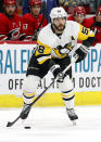 Pittsburgh Penguins' Kris Letang (58) looks to pass the puck against the Carolina Hurricanes during the second period of an NHL hockey game, Tuesday, March 19, 2019, in Raleigh, N.C. The trade talk is just heating up ahead of the draft Friday and Saturday in Vancouver. Pittsburgh’s Kris Letang is among the high-profile players who could be on the move.(AP Photo/Karl B DeBlaker, File)