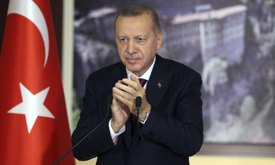 Turkey’s President Recep Tayyip Erdoğan applauds lawmakers in Istanbul in July before voting on the social media bill.