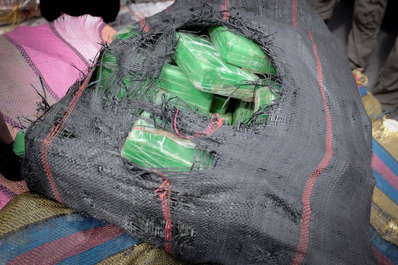 U.S. Coast Guard Cutter James offloads seized packets of cocaine and marijuana at Port Everglades