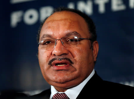 FILE PHOTO: Papua New Guinea's then Prime Minister Peter O'Neill makes an address to the Lowy Institute in Sydney, Australia November 29, 2012. REUTERS/Tim Wimborne/File Photo