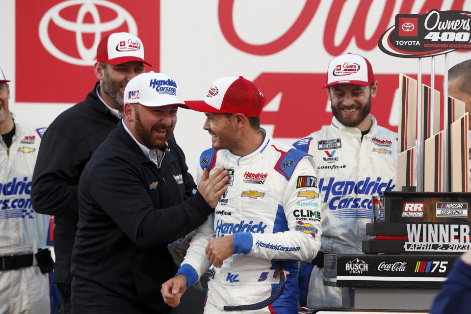 Kyle Larson, center, celebrates after winning a NASCAR Cup Series auto race at Richmond Raceway on Sunday, April 2, 2023, in Richmond, Va. (Eva Russo/Richmond Times-Dispatch via AP)