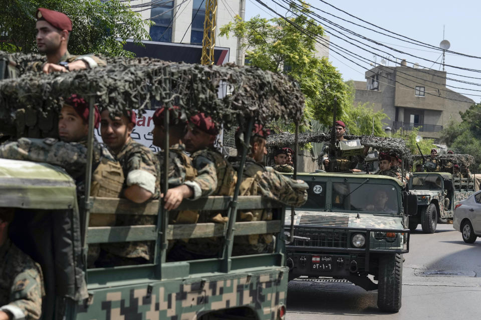 Lebanese special forces sit in their vehicle as they patrol on a road that leads to the U.S. Embassy in Aukar, a northern suburb of Beirut, Lebanon, Wednesday, June 5, 2024. A gunman was captured by Lebanese soldiers after attempting to attack the U.S. Embassy near Beirut on Wednesday, the military said. (AP Photo/Bilal Hussein)