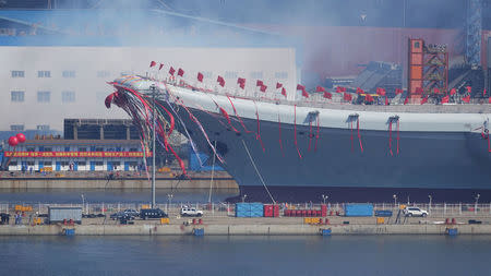 China's first domestically built aircraft carrier is seen during its launching ceremony in Dalian, Liaoning province, China, April 26, 2017. REUTERS/Stringer