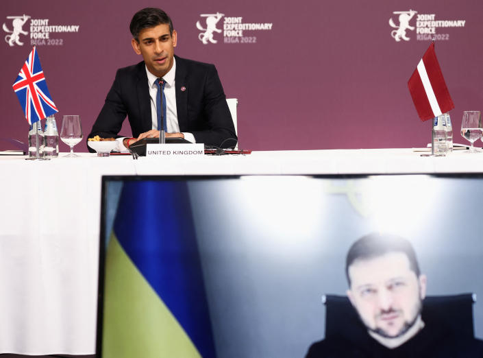 Ukrainian President Volodymyr Zelensky listens via video link as British Prime Minister Rishi Sunak speaks.