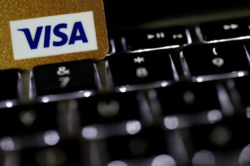 FILE PHOTO: A Visa credit card is seen on a computer keyboard in this picture illustration