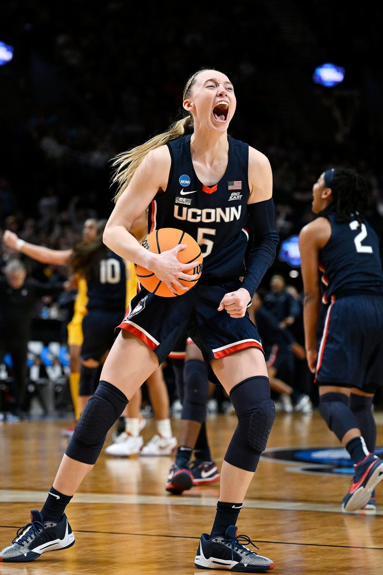 UConn guard Paige Bueckers celebrates after beating USC in the finals of the Portland Regional of the NCAA Tournament at the Moda Center.