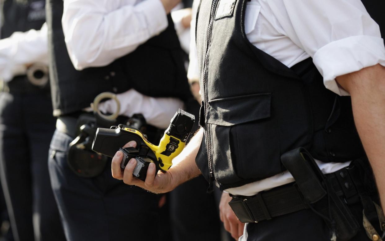 File image of a police officer holding a Taser