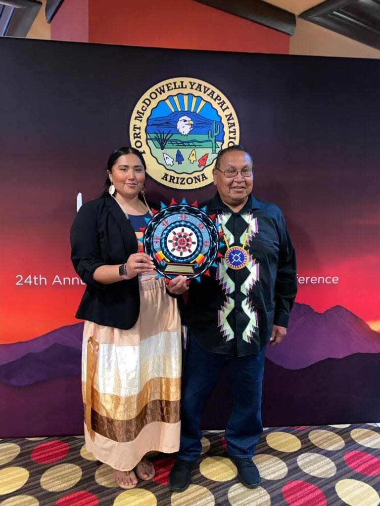 Tianna and Guss Yellowhair pose for a photo after being awarded the 2022 Excellence in Customer Service Tourism awarded by the American Indian Tourism Association.