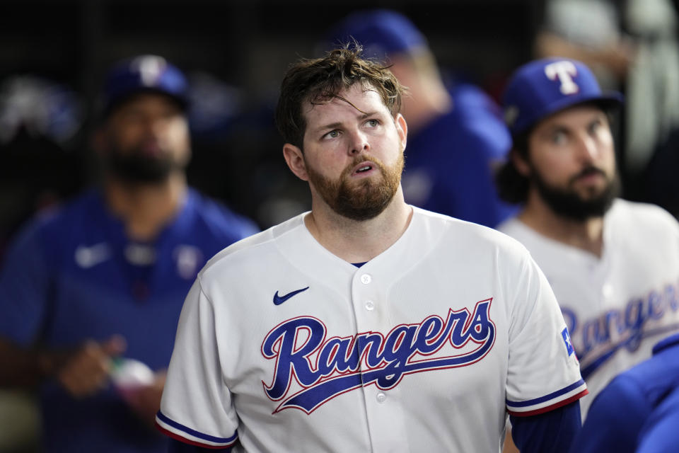 Texas Rangers starting pitcher Jordan Montgomery walks through the dugout after being pulled during the sixth inning in Game 5 of the baseball American League Championship Series against the Houston Astros Friday, Oct. 20, 2023, in Arlington, Texas. (AP Photo/Godofredo A. Vásquez)