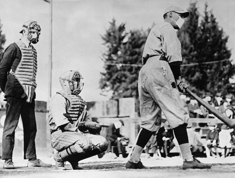 Picture shows a baseball player wearing a mask during the Flu epidemic of 1918. (George Rinhart/Corbis via Getty Images)