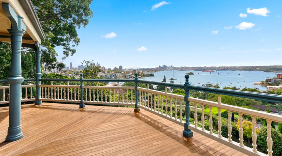 A wooden deck you can see the city and across the harbour to North Sydney.