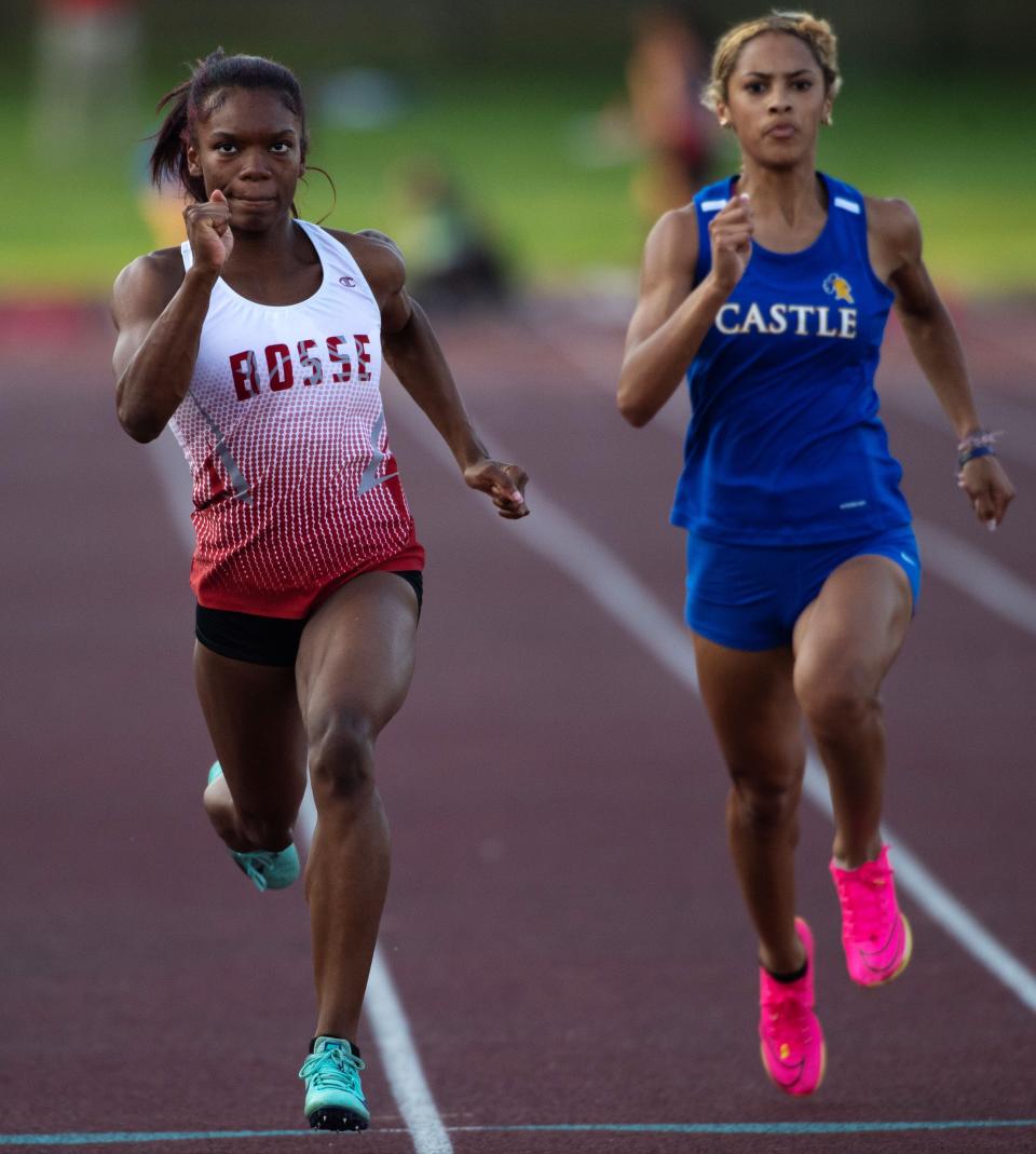 Bosse's Alexia Smith, left, and Castle's Amaya Royal compete in the 100 meter dash during the IHSAA Girls Regional 8 Track & Field Meet at Central Stadium Tuesday evening, May 23, 2023. Smith came in first place with a time of 12.03 seconds and Royal came in second place with a time of 12.33 seconds.