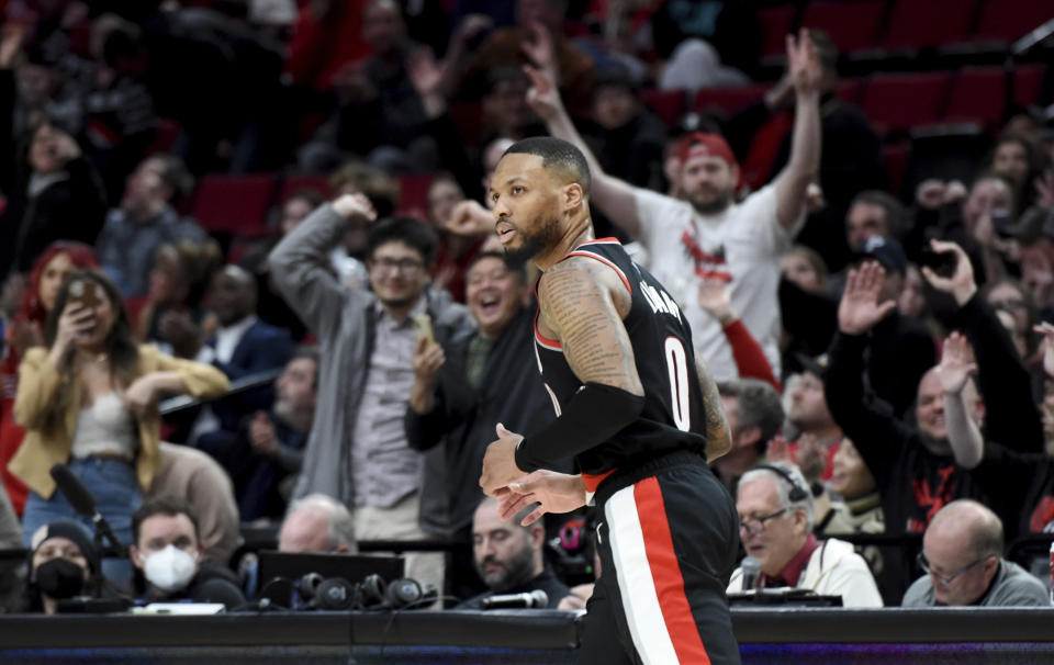 Portland Trail Blazers guard Damian Lillard, heads back up the court after scoring during the second half of an NBA basketball game against the Houston Rockets in Portland, Ore., Sunday, Feb. 26, 2023. (AP Photo/Steve Dykes)