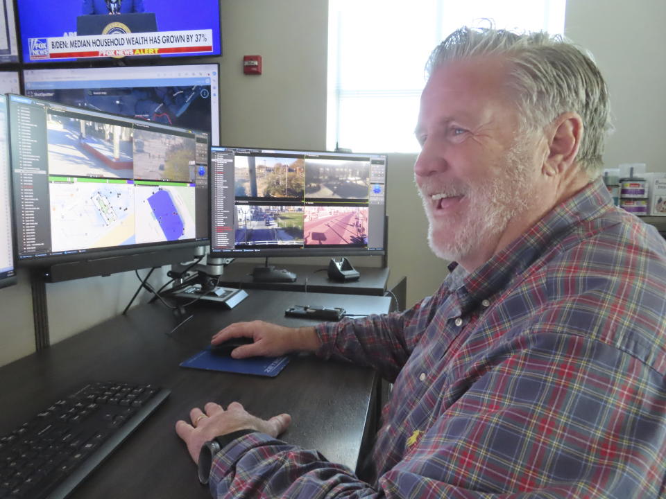 Bill McMenamin, a retired Atlantic City, N.J., police captain, monitors video screens in the department's surveillance center, where he currently works, on Nov. 16, 2023. The city is adding hundreds of security cameras to the 3,000 already keeping an eye on it. (AP Photo/Wayne Parry)