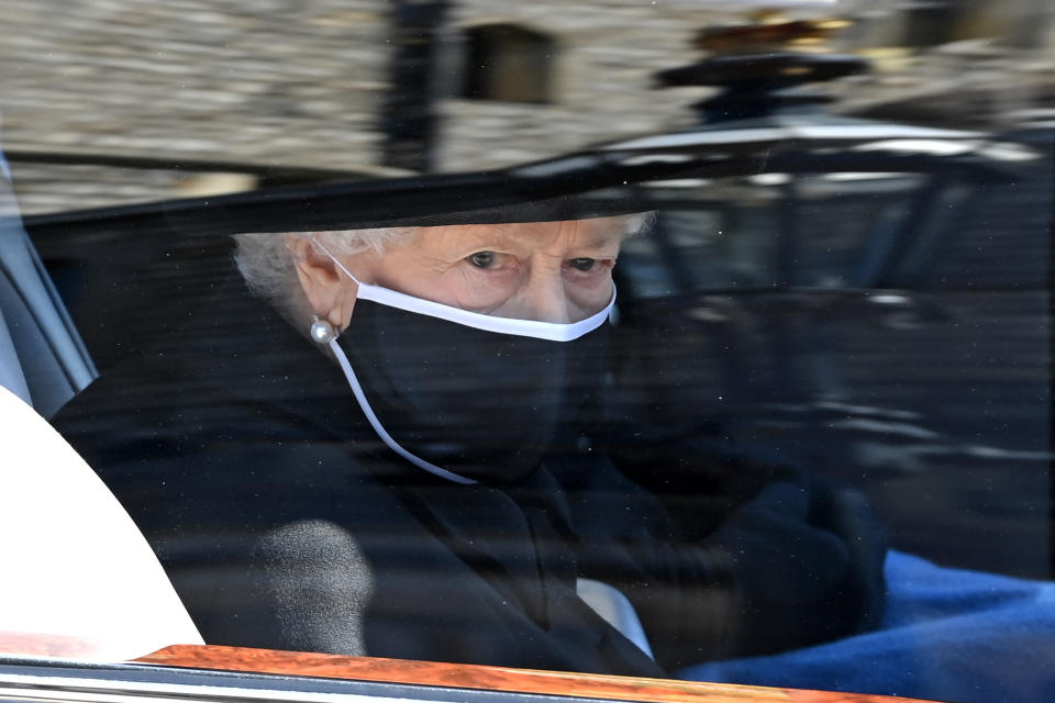 WINDSOR, ENGLAND - APRIL 17: Queen Elizabeth II arrives for the funeral of Prince Philip, Duke of Edinburgh at Windsor Castle on April 17, 2021 in Windsor, England. Prince Philip of Greece and Denmark was born 10 June 1921, in Greece. He served in the British Royal Navy and fought in WWII. He married the then Princess Elizabeth on 20 November 1947 and was created Duke of Edinburgh, Earl of Merioneth, and Baron Greenwich by King VI. He served as Prince Consort to Queen Elizabeth II until his death on April 9 2021, months short of his 100th birthday. His funeral takes place today at Windsor Castle with only 30 guests invited due to Coronavirus pandemic restrictions. (Photo by Leon Neal/WPA Pool/Getty Images  )