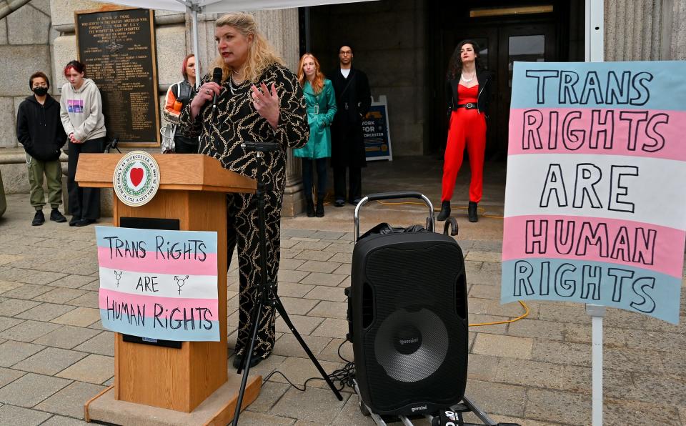 Trans woman Penelope Conely speaks during the Trans Day of Visibility rally at City Hall on Friday.