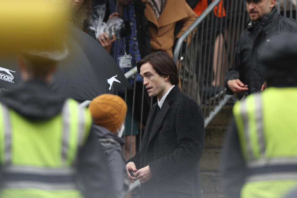 Actor Robert Pattinson during filming of The Batman outside St George's Hall in Liverpool, England, Monday Oct. 12, 2020. (Peter Byrne/PA via AP)
