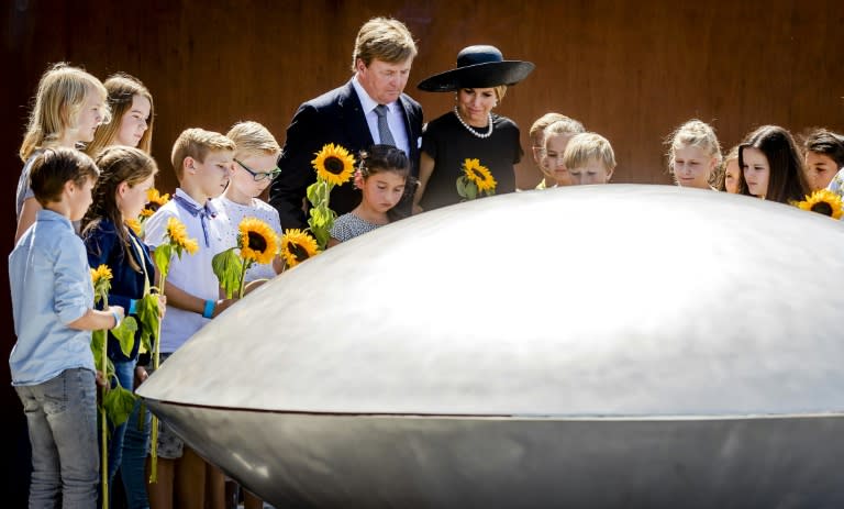 King Willem-Alexander (centre, left) and Queen Maxima attend the unveiling of the monument for the victims of Flight MH17 in Vijfhuizen, in the Netherlands, on July 17, 2017