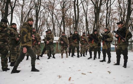 Pro-Russian separatists from the Chechen "Death" battalion take part in a training exercise in the territory controlled by the self-proclaimed Donetsk People's Republic, eastern Ukraine, December 8, 2014. REUTERS/Maxim Shemetov