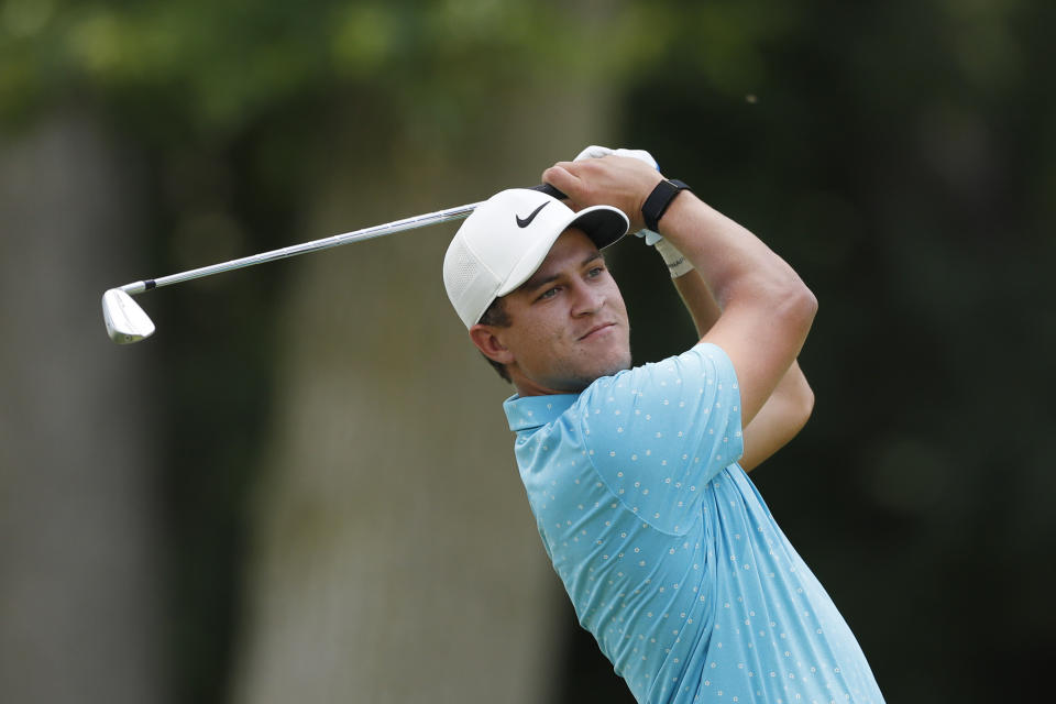 Cameron Champ drives from the 11th tee during the first round of the Rocket Mortgage Classic golf tournament, Thursday, July 2, 2020, at the Detroit Golf Club in Detroit. Champ was cleared to join the field under a modified PGA Tour policy that allows players who test positive for the coronavirus to be eligible if they had no symptoms and get two negative test results at least 24 hours apart. (AP Photo/Carlos Osorio)