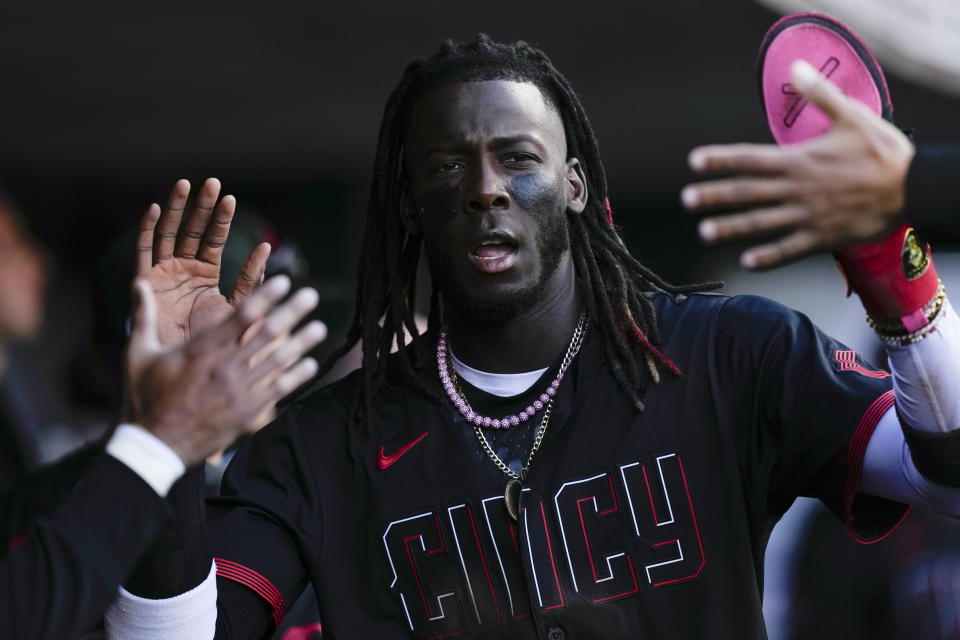 Cincinnati Reds' Elly De La Cruz celebrates with teammates after scoring in the second inning of a baseball game against the Los Angeles Angels, Friday, April 19, 2024, in Cincinnati. (AP Photo/Carolyn Kaster)