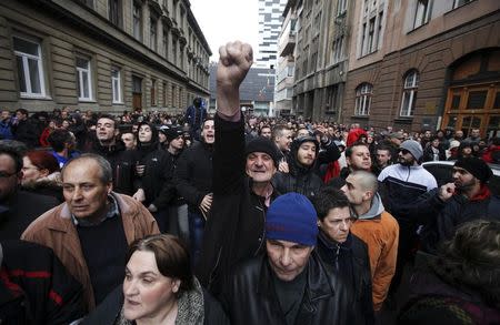 Anti-government protesters chant slogans during a rally in Sarajevo in this February 9, 2014 file photo. REUTERS/Antonio Bronic/Files