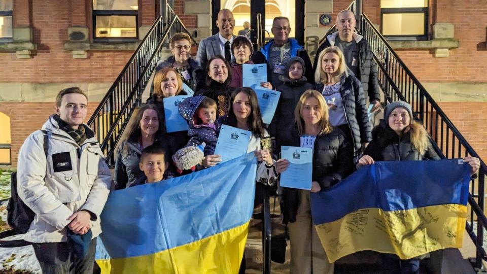 Members of the Ukrainian community of P.E.I. celebrated on the stairs of the Coles Building yesterday, after bill passed unanimously in the legislature recognizing the Ukrainian famine in 1932 and 1933 as a genocide. 