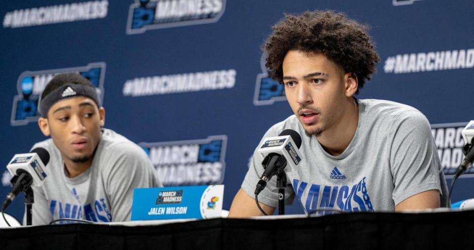 Kansas forward Jalen Wilson, right, speaks as guard Dajuan Harris Jr. listens during a press conference ahead of Kansas’ first round game against Howard in the NCAA college basketball tournament Wednesday, March 15, 2023, in Des Moines.