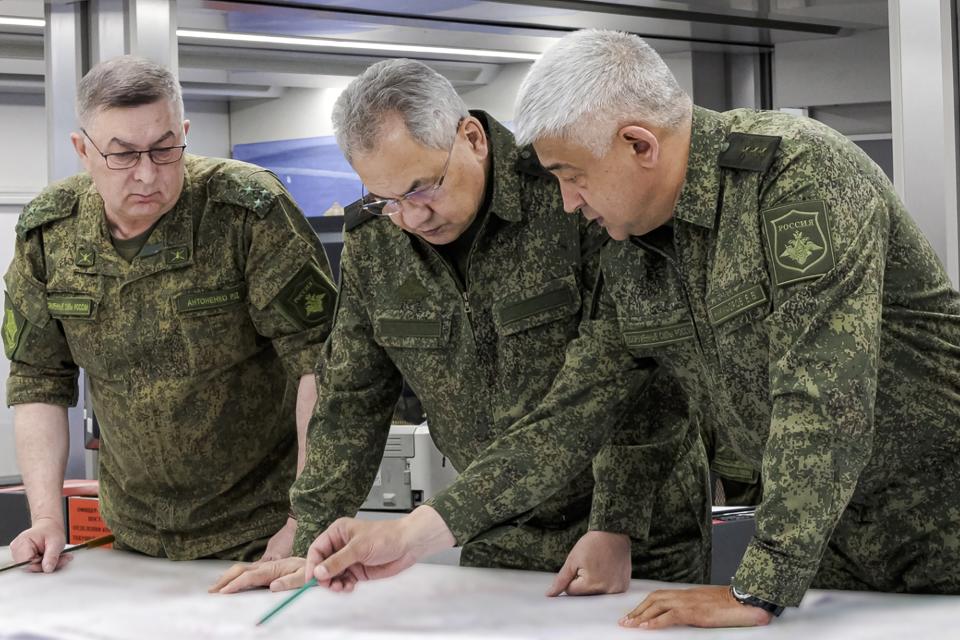 In this photo released on Monday, June 26, 2023 by the Russian Defense Ministry Press Service, Russian Defense Minister Sergei Shoigu, center, and Yevgeny Nikiforov, the commander of the Western Military District, right, inspect a command post of one of the formations of the Zapad (West) group of Russian troops at an undisclosed location of Ukraine. Shoigu made his first public appearance Monday since a mercenary uprising demanded his ouster, inspecting troops in Ukraine. (Russian Defense Ministry Press Service via AP)