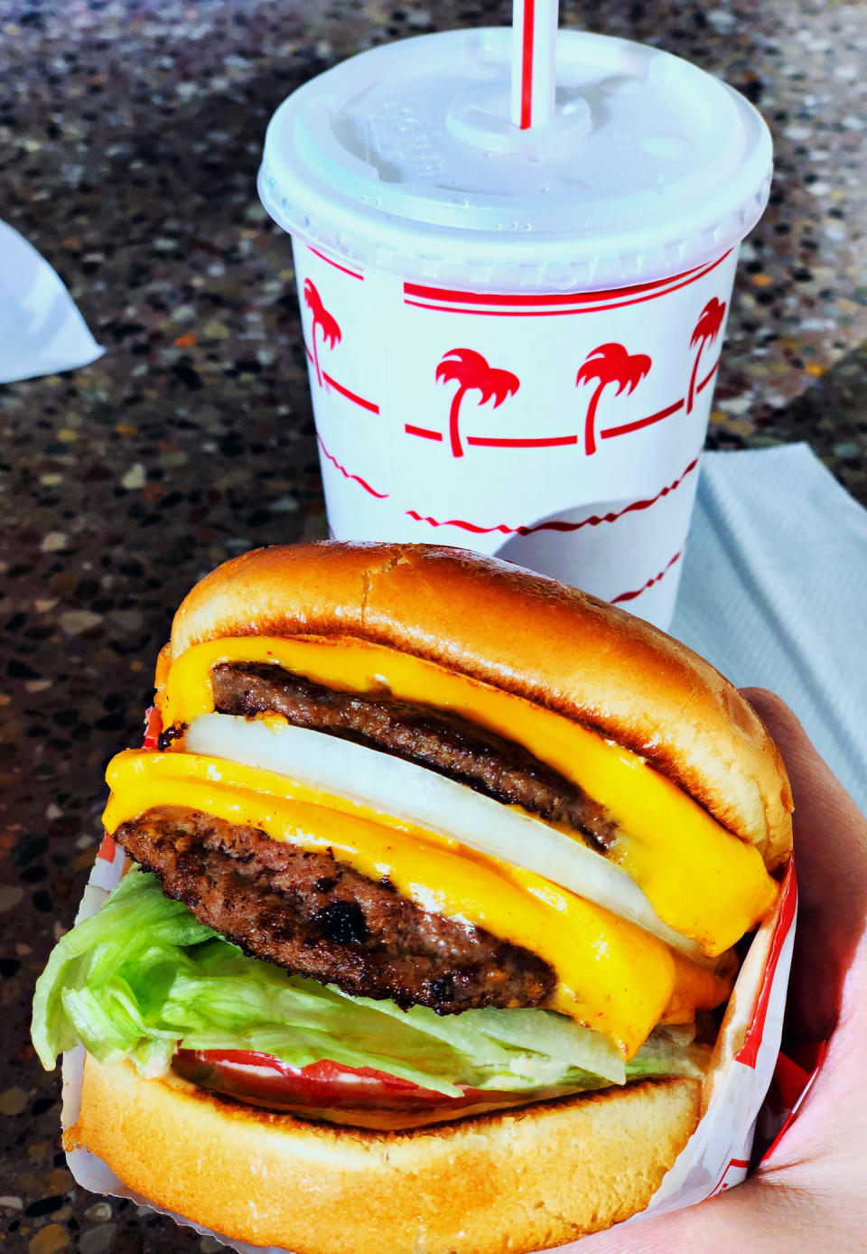 Double cheeseburger with lettuce and tomato